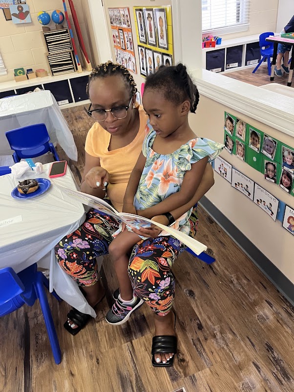 Creekside Montessori parents community event mother and daughter reading