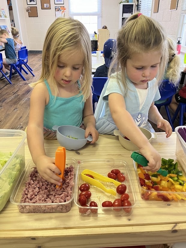 Preschool student getting a balance health fresh food snack