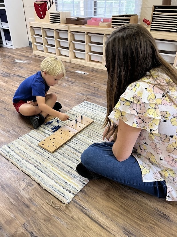 Teacher working one on one with a student learning foundations of math